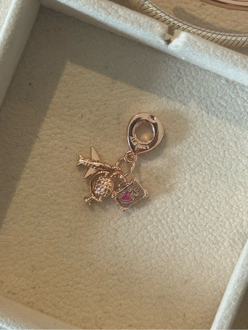 Pandora rose gold travel charm